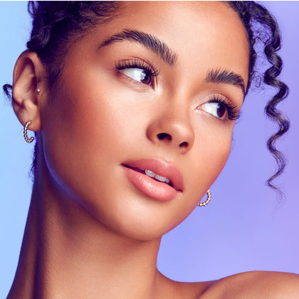 A woman wearing light, fluffy looking lashes from Falscara Studio Palette in 'Xtra Fluffy'.