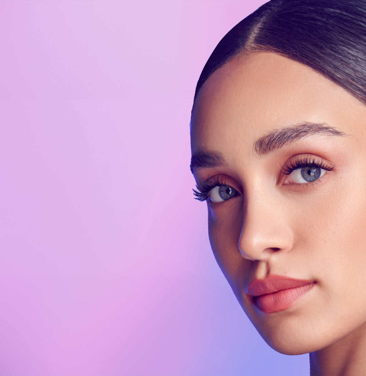 A woman modeling beautiful, full and curly lashes from Falscara Studio collection.