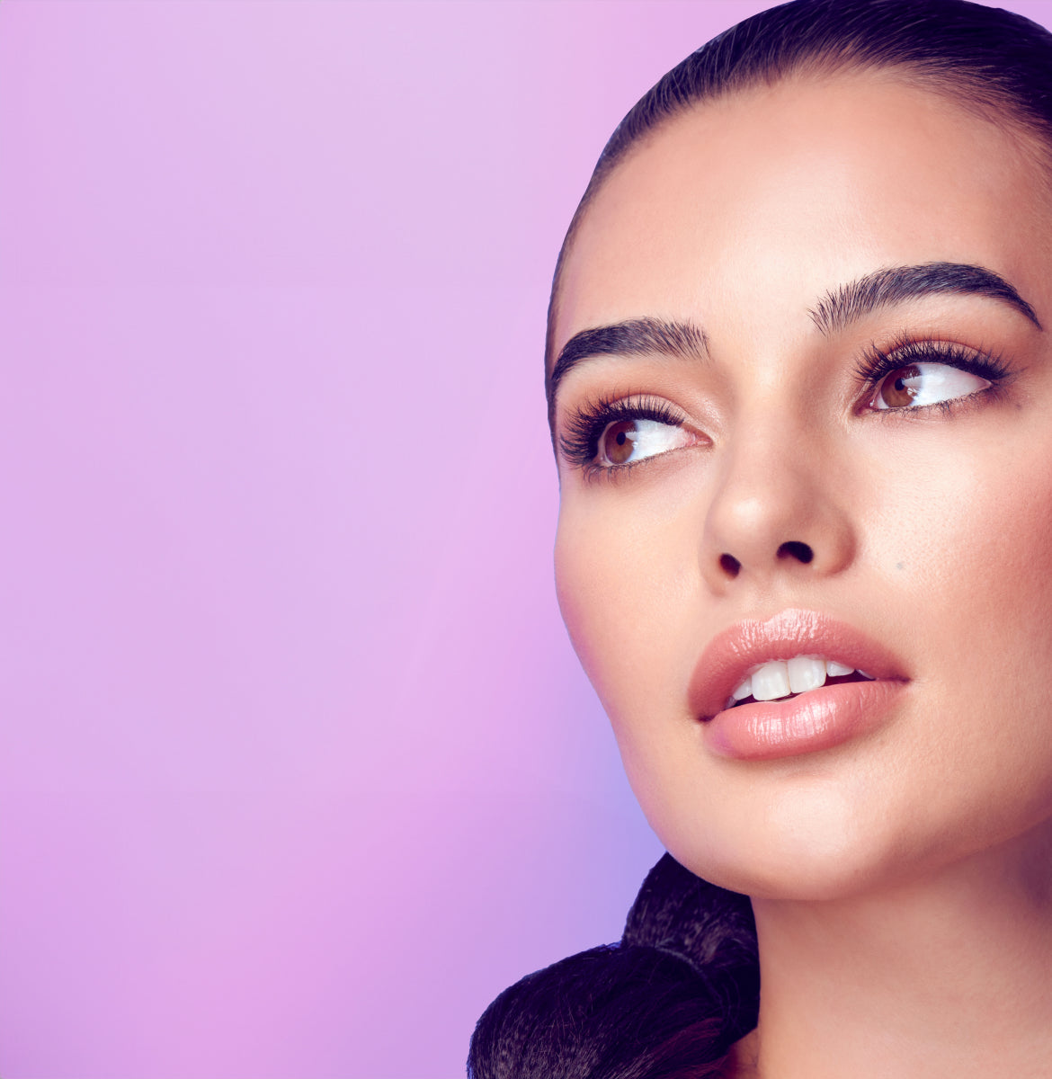 A woman wearing false lashes that look light and wispy. Lashes are Falscara Studio Palette lashes.