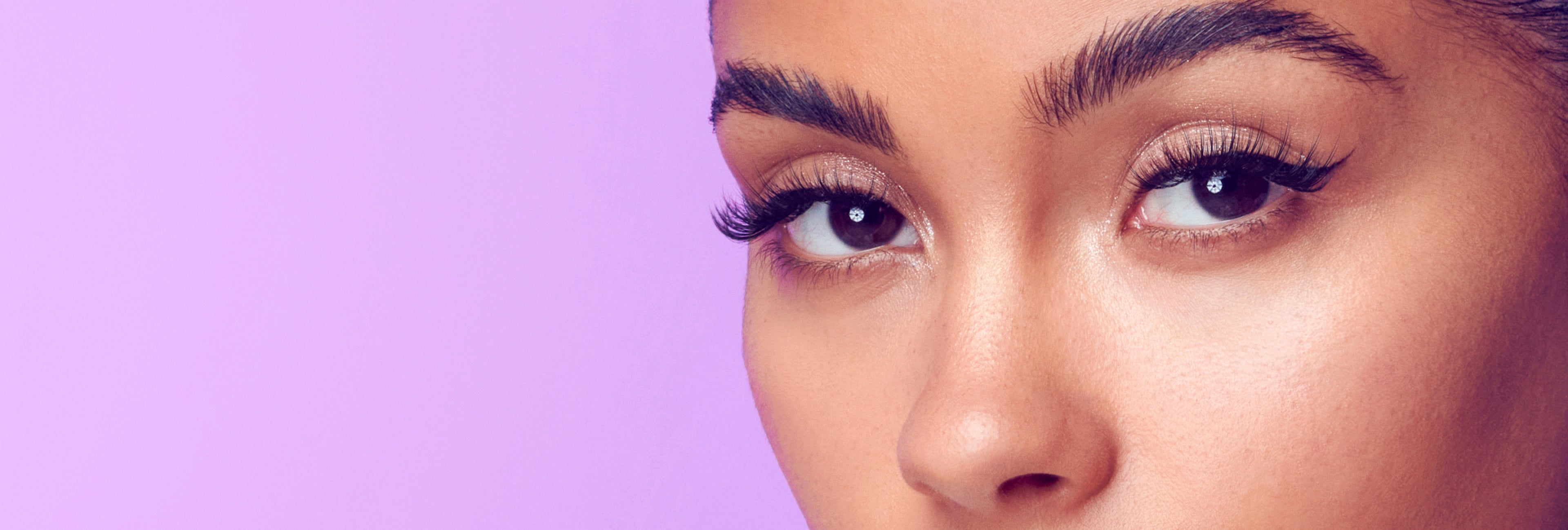 A woman modeling Falscara Studio lashes that are wispy with good volume. Each box of Studio lashes comes with 3 lash lengths so you can create a custom lash look.
