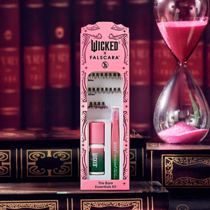 Wicked Falscara lash kit with applicator, adhesive, and lash strips on bookshelf display.