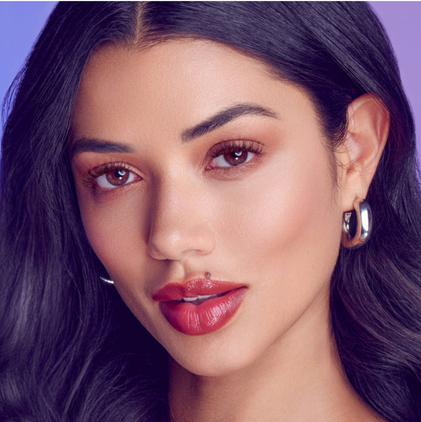 A woman modeling Falscara Studio Palette lashes in "Dark Chocolate Spiky". Lashes are dark brown and wispy for a more natural lash look. 