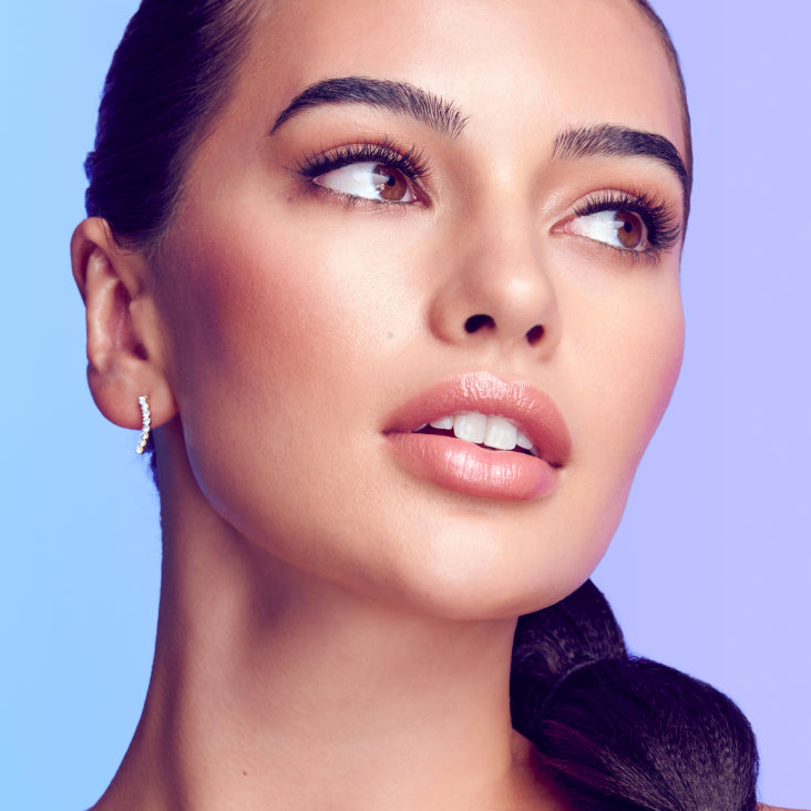 A beautiful woman showing off lashes with petite volume that add some light style and flair. Lashes are Falscara Studio Palette lashes in "Xtra Light".