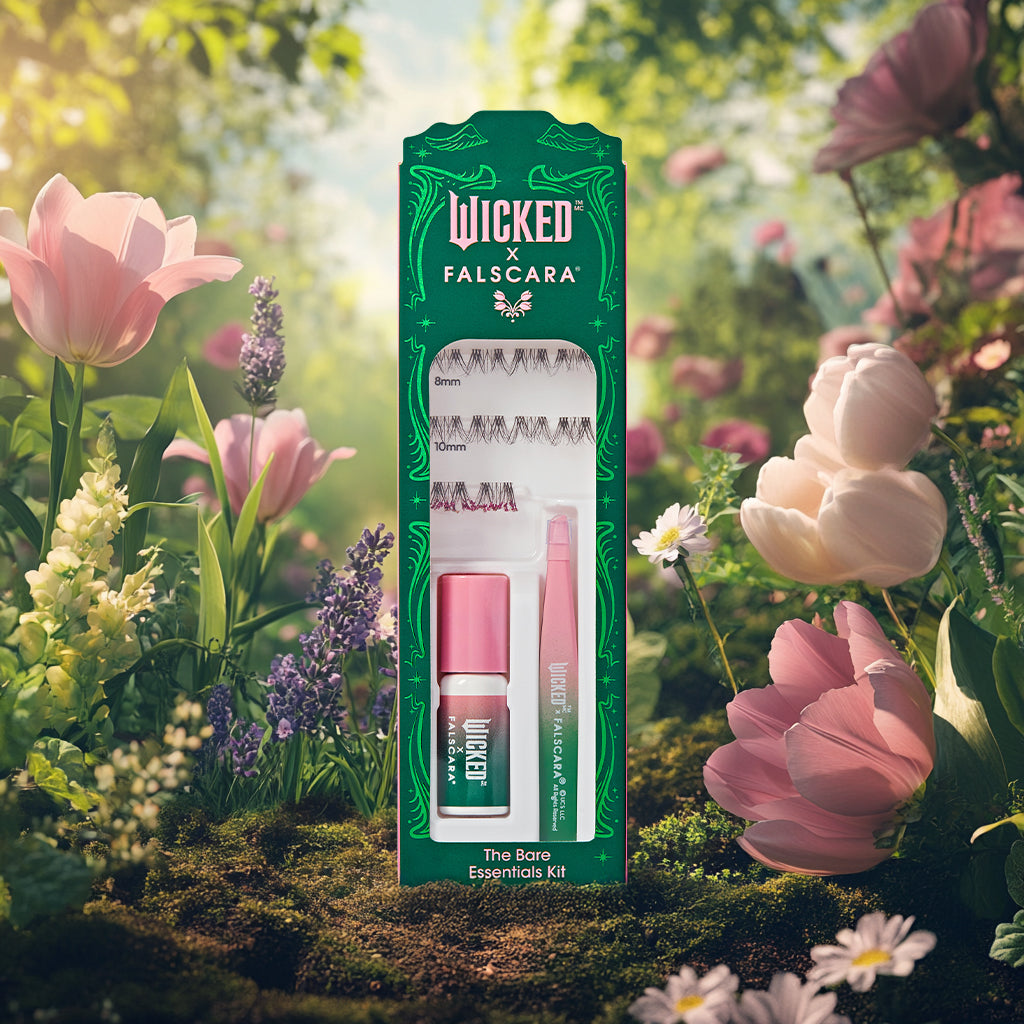 Wicked x Falscara The Bare Essentials Kit displayed in garden setting with flowers