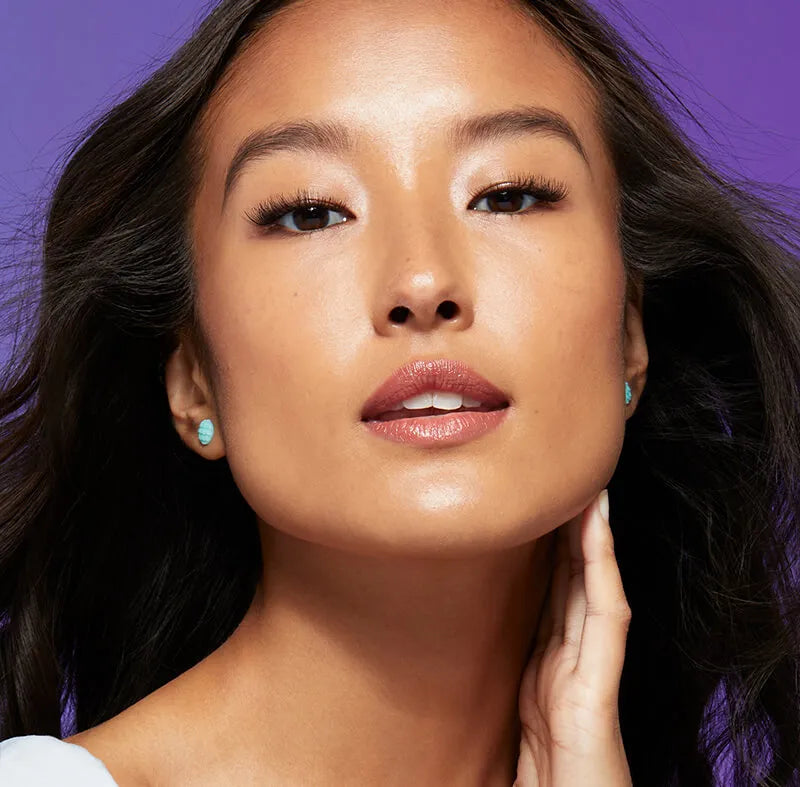 A woman wearing Falscara false lashes that give her natural lashes more length and volume without being too dramatic.