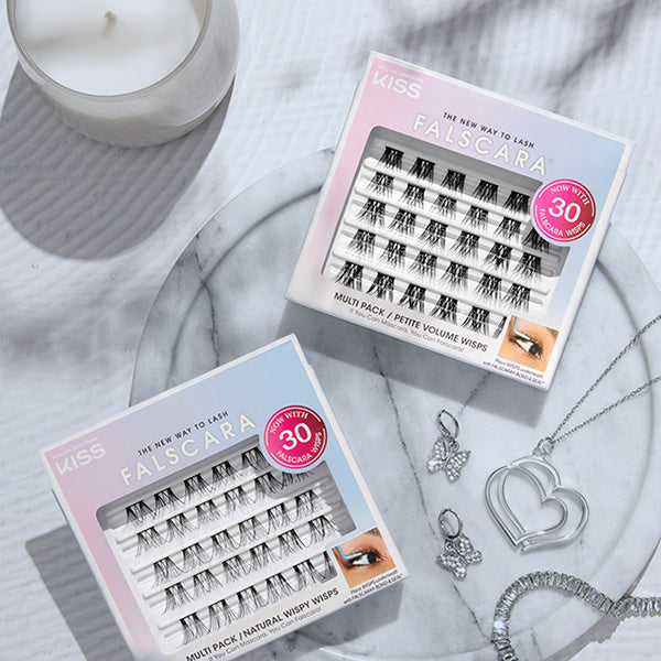 Two packages of Falscara multipacks of lashes - 'Natural Wispy Wisps'  and 'Petite Volume Wisps'. Both packs come with 30 lash clusters. 